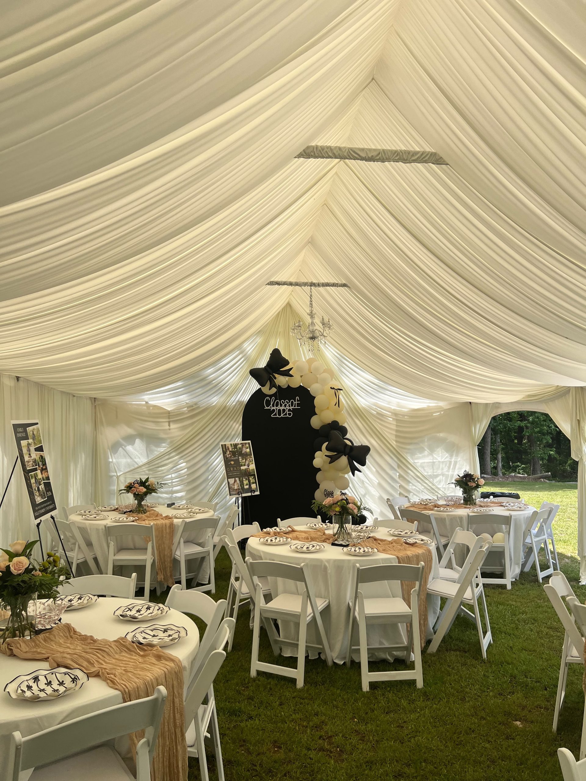 Elegant event rental setup with tent draping by Nino's Party Rentals